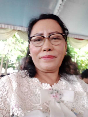 Dra. Dewi Damanik